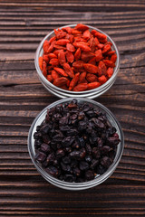 dried goji berries on a wooden rustic background