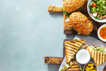 Grilled sandwich nuggets, salad copy space top view Various snacks Outdoor food