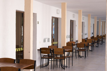 terrace of a hotel with chairs and tables