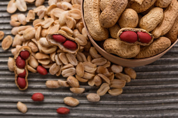 fresh peanuts on a wooden rustic background