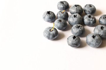 Fresh blueberries on a light background. Close up. The concept of natural food
