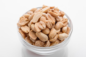 fresh peanuts on a white acrylic background