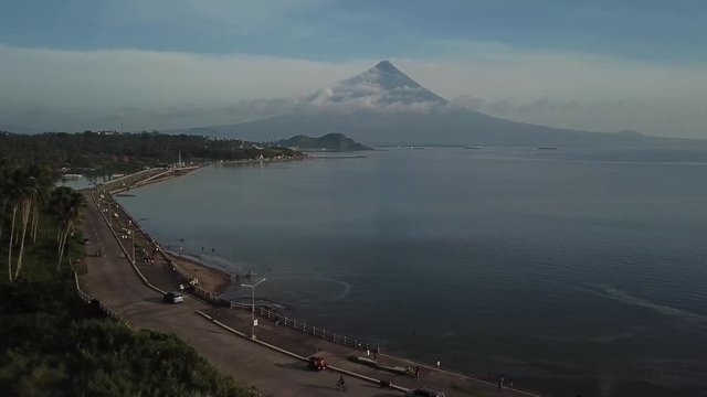 AERIAL SHOT: Puro and Lamba, Legazpi City, Philippines. Views of cocount trees, Mayon Volcano and the sea