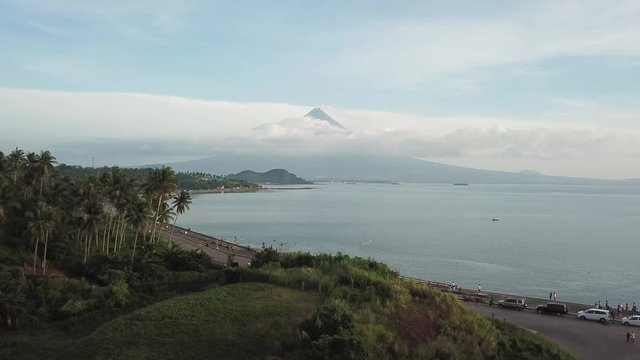 AERIAL SHOT: Puro and Lamba, Legazpi City, Philippines. Views of cocount trees, Mayon Volcano and the sea