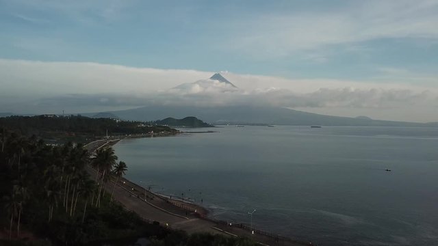 AERIAL SHOT: Puro and Lamba, Legazpi City, Philippines. Views of cocount trees, Mayon Volcano and the sea