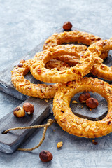 Homemade shortbread rings sprinkled with nuts.
