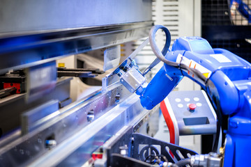 Hand robot working automatic cutting and bending metal sheet by high precision metal sheet bending...