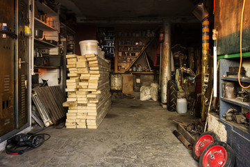 Fototapeta na wymiar interior of a rural barn with a workshop and a repository of materials