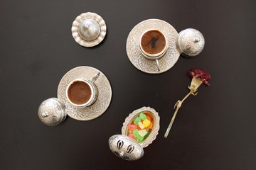 Fresh hot turkish coffee with turkish delight.