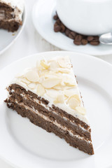 piece of chocolate cake with cream, close-up