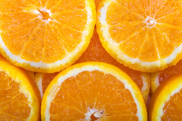 Colorful orange citrus fruit slices background top view