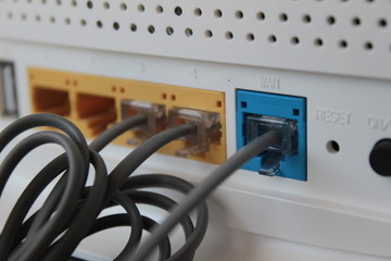 Electronic wires connected to ports of ADSL. WAN input is also just next to ports.