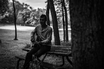 man playing acoustic guitar