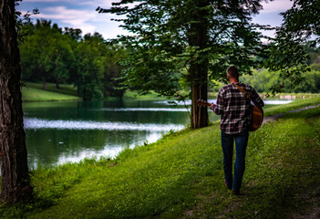 man playing acoustic guitar