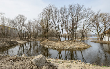 Spring naked trees on riverbank in Dnepropetrovsk, Ukraine.