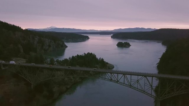 Sunrise at Landmark Deception Pass Bridge Over Puget Sound in Washington with Mt Baker Background