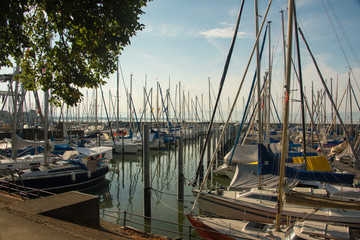 The marina of Friedrichshafen at Lake Constance in front of a bright blue sky