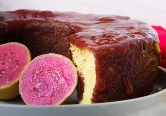 Typical Brazilian sweet dessert corn cake with guava paste. And guavas fruits  composing the scene.