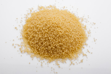 fresh couscous on a white acrylic background