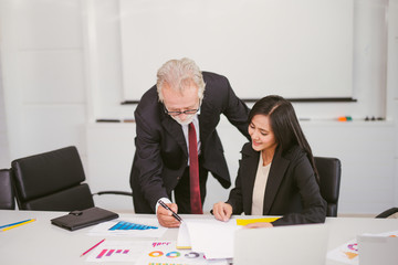 senior businessman sign a contract in office
