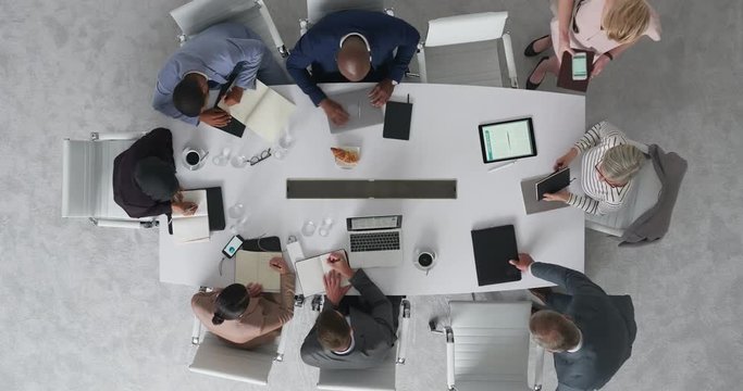 time lapse diverse marketing research team brainstorming ideas on successful business solution planning strategy using colorful note paper in modern boardroom top view
