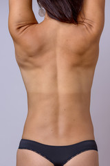 Bare back of a slender athletic toned woman