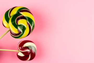 Sweet lollipop candy on a color background