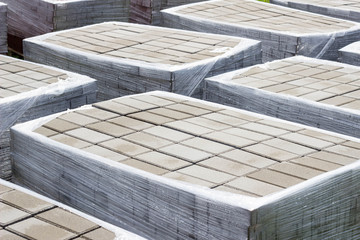 pallets with a paving slab made of mortar, brick, paving brick