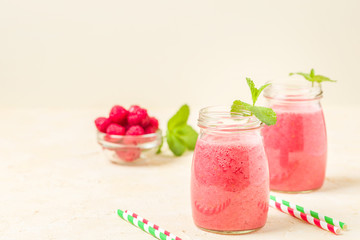 Raspberry smoothie close up photography with fresh summer blended cocktail and ripe berries.