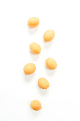 Yellow apricots on white background.