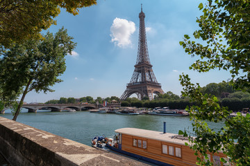 Eiffel Tower with house boat in front