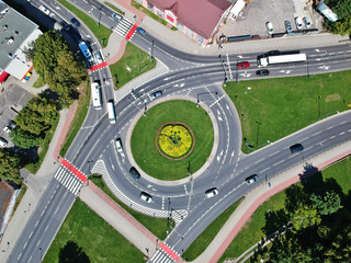 Roundabout intersection in three directions with island, aerial view