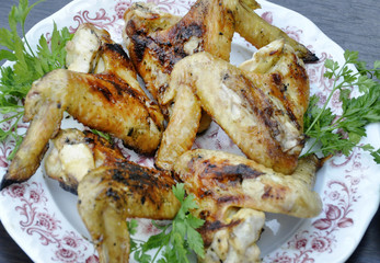 apetitic fried chicken cranberries in a plate on a dark wooden table