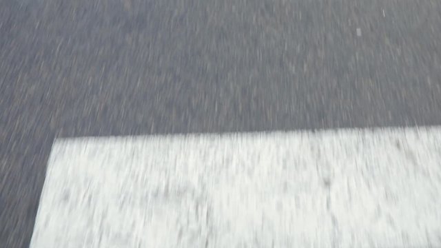 Male legs cross the road on zebra