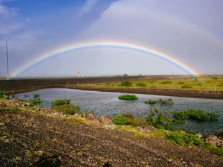 Fototapeta na wymiar Rainbow over highway in Iceland