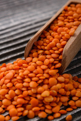 raw lentils on a wooden rustic background