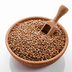 raw lentils on a white acrylic background