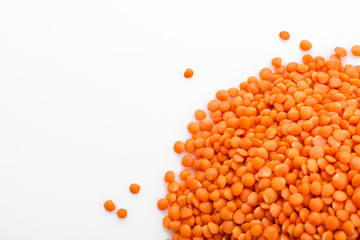 raw lentils on a white acrylic background