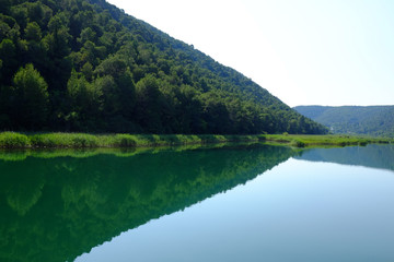 Fototapeta na wymiar Beautiful reflection on Krka river water at Skradin, Croatia
