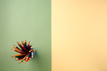 Back to school concept on green and yellow texture paper background.