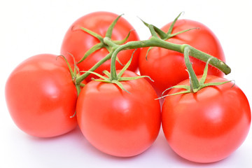 Isolated tomatoes on a white background.