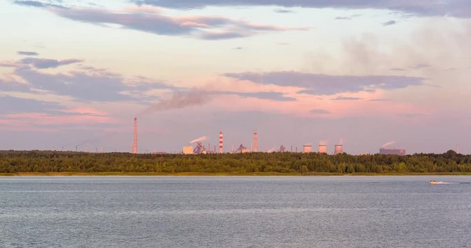 Pogoria 4 lake with industrial zone in the background at sunset, Dabrowa Gornicza, Poland. Timelapse