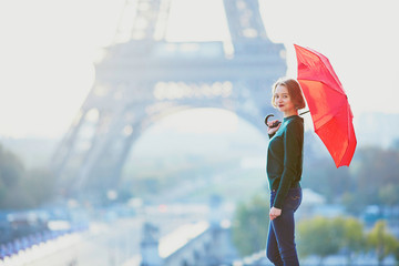 Girl in Paris near the Eiffel tower at morning