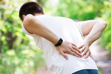 Man with back pain, kidney inflammation, trauma during workout