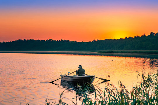 man fishes in the lakes of the Mazury
