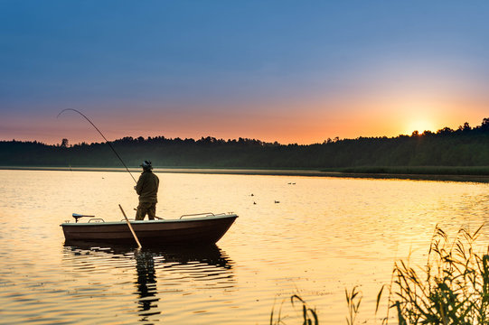 man fishes in the lakes of the Mazury
