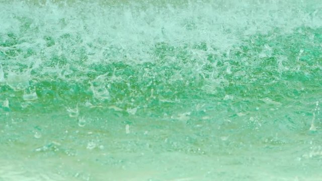 Water drops splashing and dripping on fountain surface in old european city Rome. Slow motion.