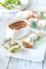 Fototapeta na wymiar Shrimp rice paper rolls with peanut sauce