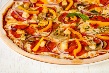 Pizza with salami and mushrooms