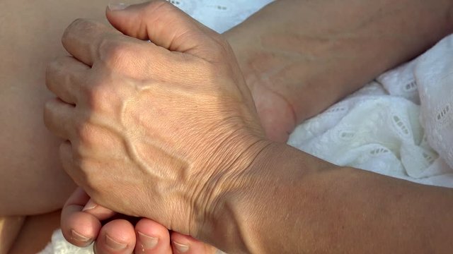 veins of hands and skin of arms of mature woman